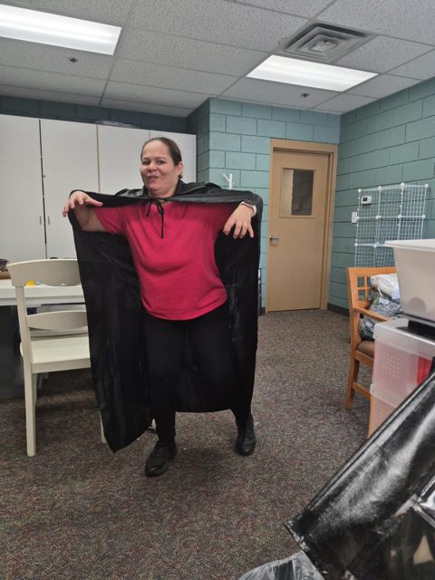 Trying on a costume cape