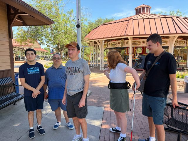 A group stop by the pavilion