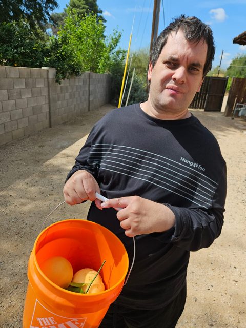 Ready to help with a bucket of produce