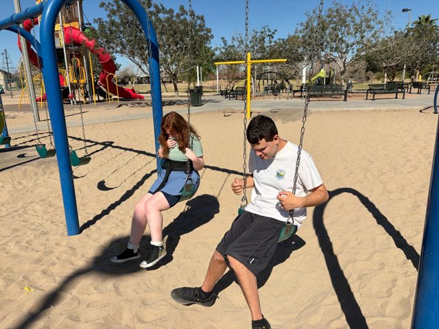 Friends on the swings